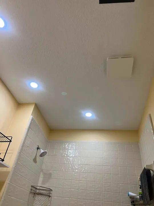 Same bathroom with a new ceiling, recessed lights and fresh paint