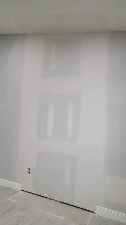 Same wall with new drywall taped and finished