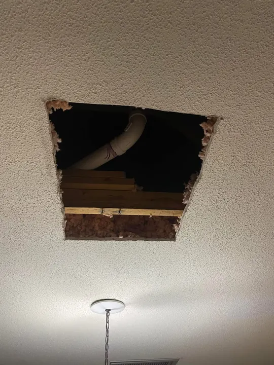 Ceiling opened to reach a leaking drain pipe