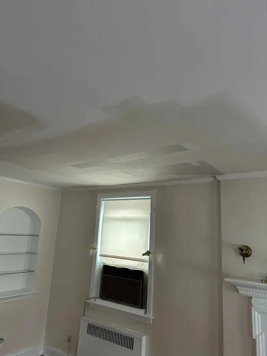 Same living room ceiling rebuilt and finished smooth