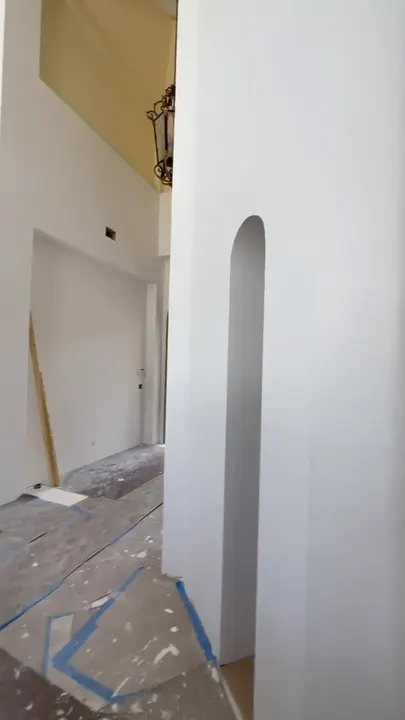 Arched drywall openings and rounded column in a custom home