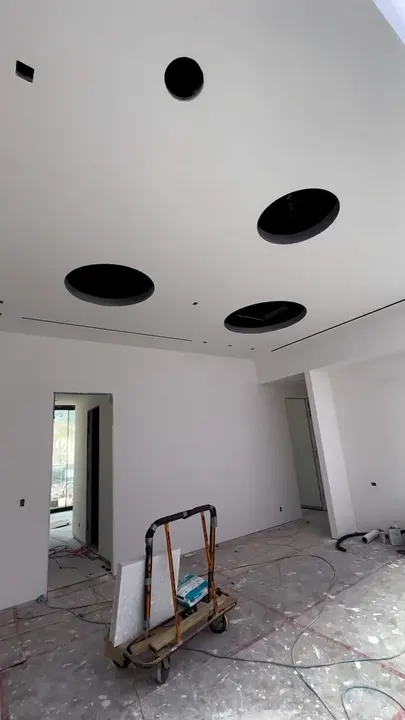 New-construction room with smooth drywall and linear AC diffusers