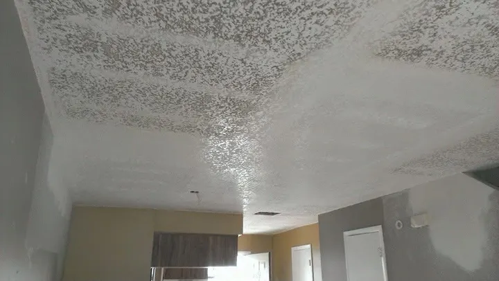 Ceiling texture being refinished after popcorn removal
