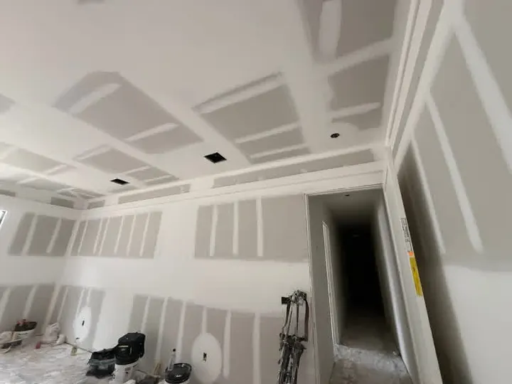 Tray ceiling and hallway with first coat of joint compound on new drywall